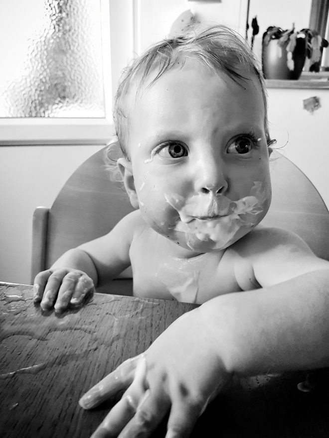 Yoghurt covered face and water spillage