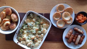 Sausages with roasties and caulbrocci cheese