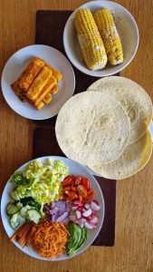 Fish finger tacos with corn on the cob