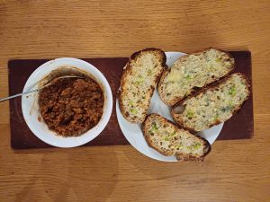 Lentil and quinoa ragu with cheese on toast