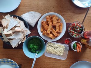 Fish finger nachos with peamole