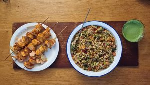 Harissa salmon kebabs with giant couscous salad