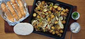 Baked salmon with roast potatoes fennel and lemon